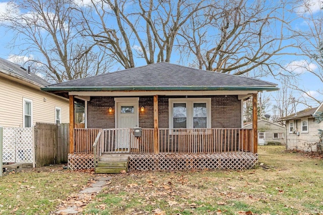 view of front of home with a front lawn and covered porch