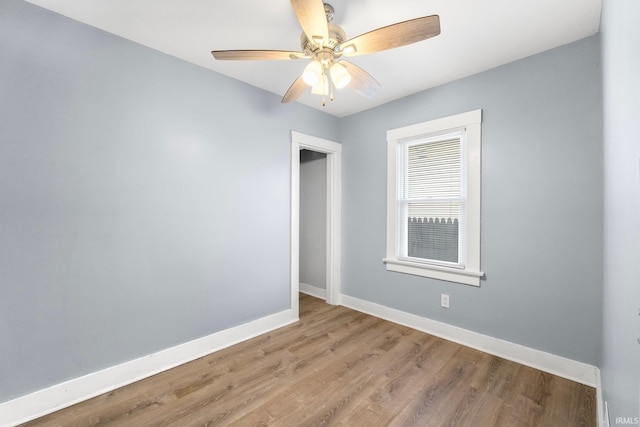 spare room featuring ceiling fan and light hardwood / wood-style flooring