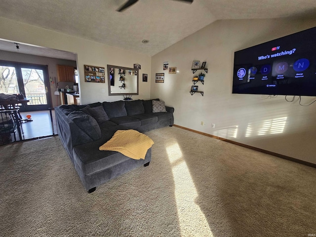 carpeted living room featuring vaulted ceiling