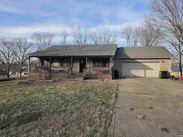 ranch-style house with a porch, a garage, and a front lawn