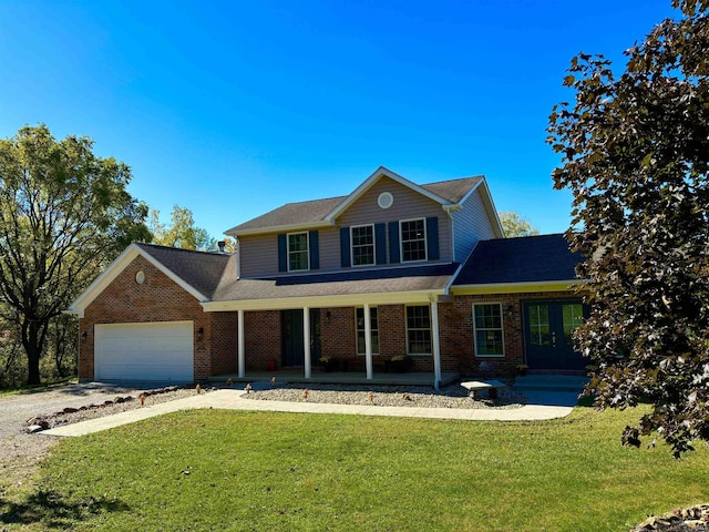 front of property with a garage, covered porch, and a front lawn