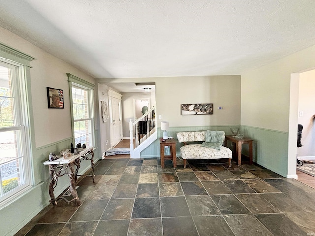 living area with a textured ceiling