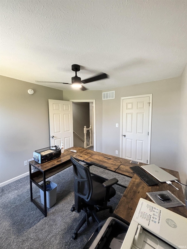 office with ceiling fan, carpet floors, and a textured ceiling