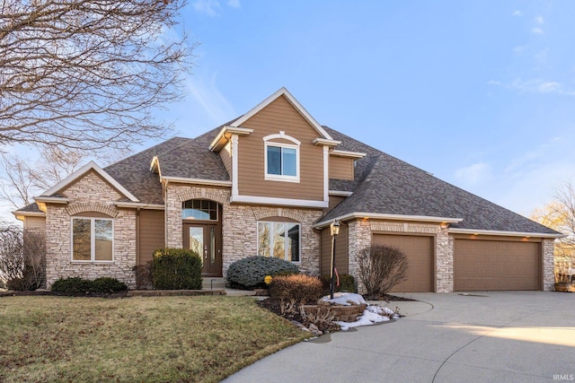 view of property with a garage and a front yard