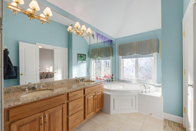 bathroom with lofted ceiling, a chandelier, tile patterned flooring, vanity, and a bath