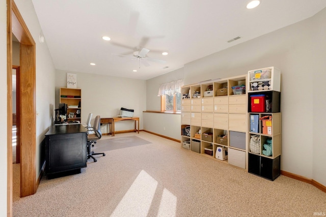 home office featuring ceiling fan and light colored carpet