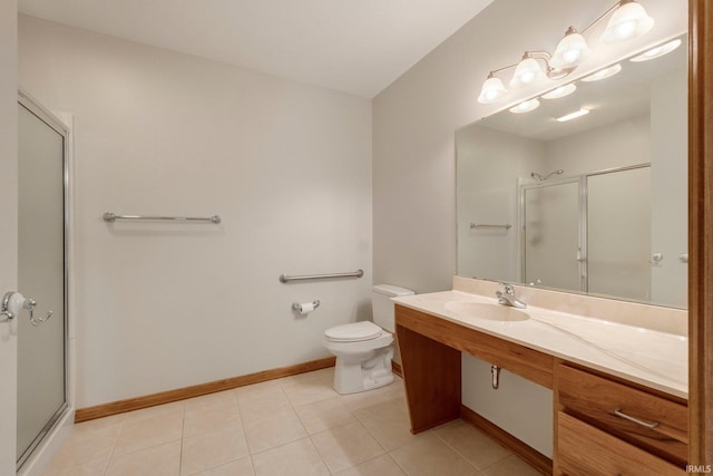 bathroom featuring a shower with door, vanity, tile patterned flooring, and toilet