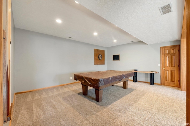 rec room featuring billiards, light carpet, and a textured ceiling