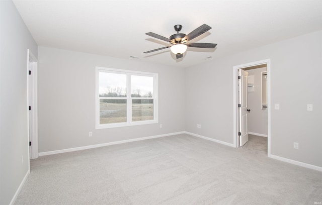 empty room with light carpet and ceiling fan