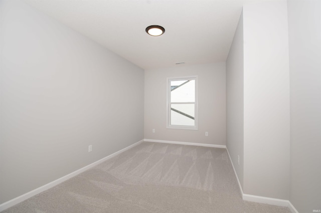 empty room with light colored carpet