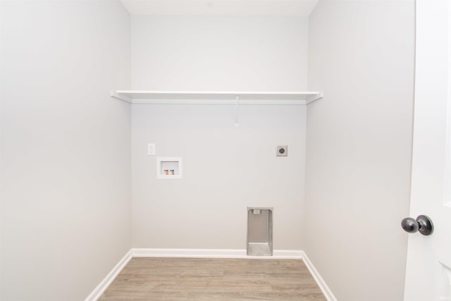 washroom with hookup for a washing machine, hookup for an electric dryer, and light wood-type flooring