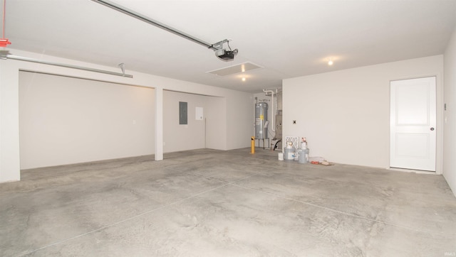 garage with a garage door opener, electric panel, and water heater