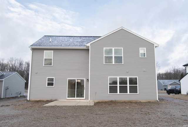 rear view of house featuring a patio