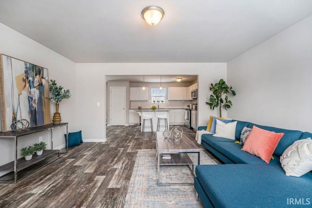 living room with dark hardwood / wood-style floors