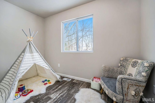 playroom with hardwood / wood-style floors