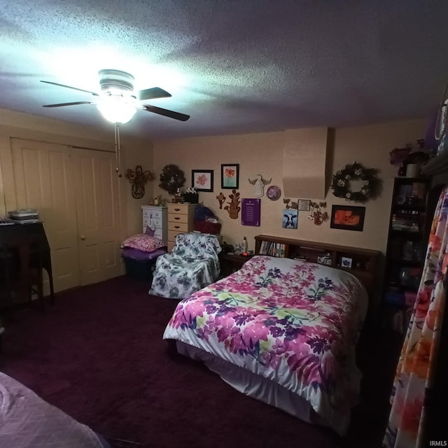 carpeted bedroom with ceiling fan and a textured ceiling