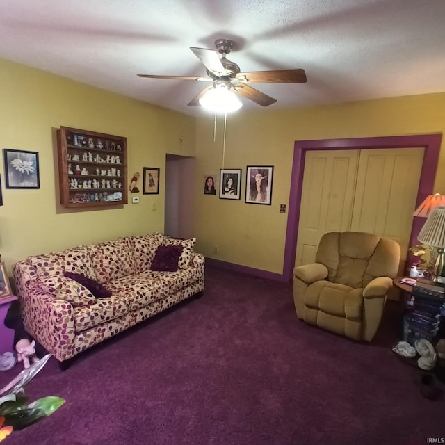 carpeted living room featuring ceiling fan