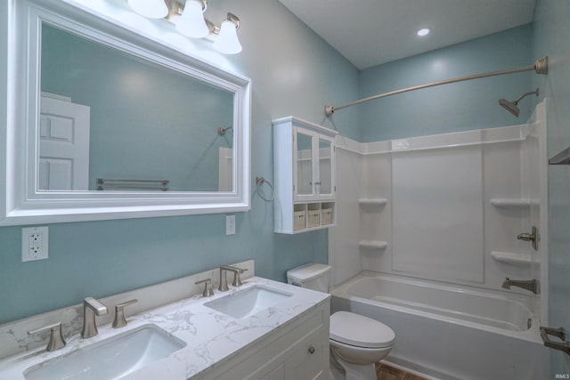 full bathroom with bathing tub / shower combination, vanity, and toilet