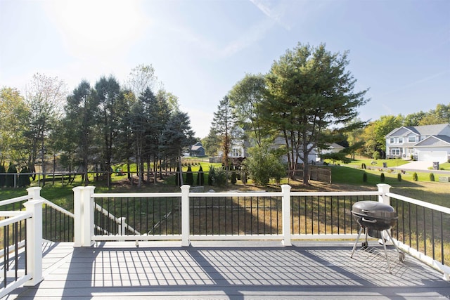 wooden terrace with a residential view and area for grilling