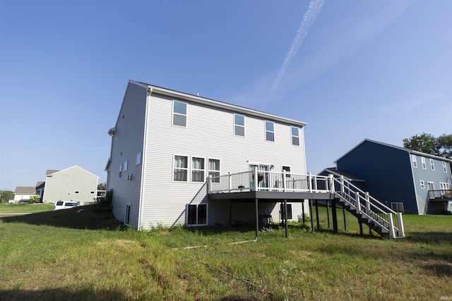 rear view of house featuring stairs, a yard, and a wooden deck