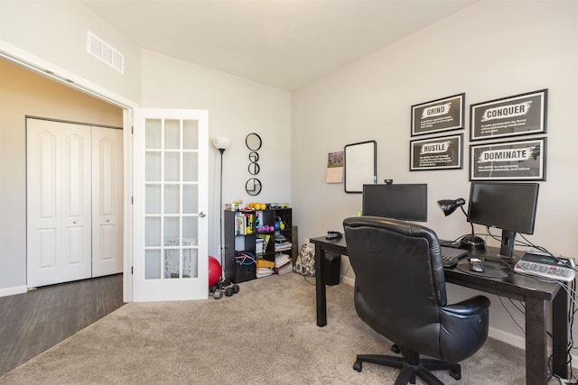 office area with lofted ceiling, carpet floors, and french doors