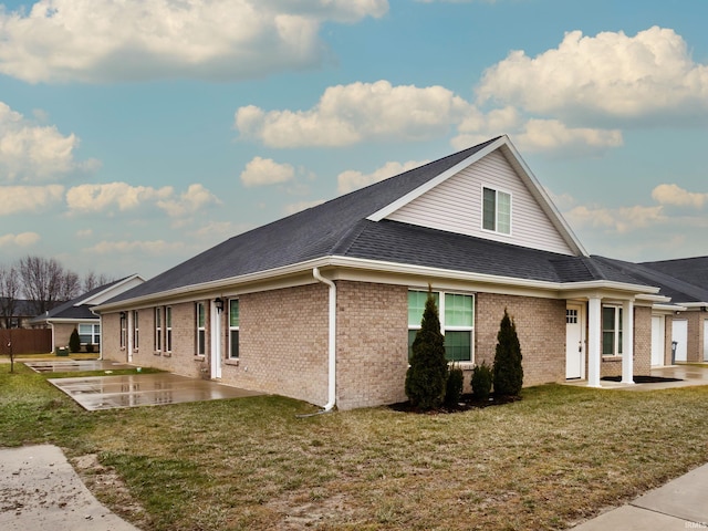 exterior space featuring a yard and a patio area