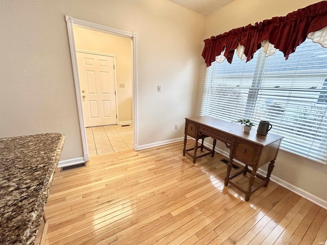 office area with light hardwood / wood-style flooring