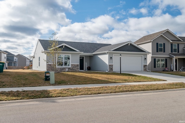 view of front of house featuring a garage and a front yard