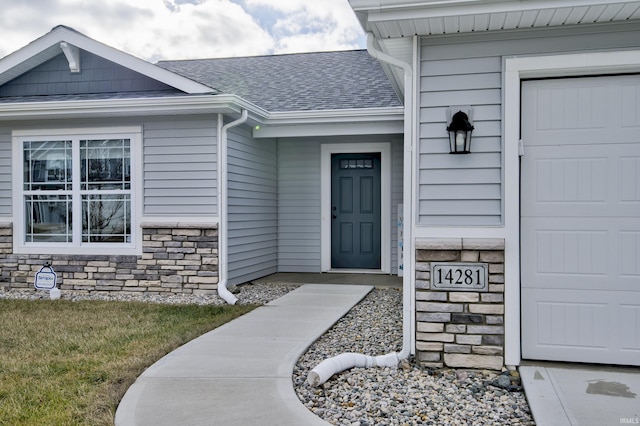 property entrance with a garage