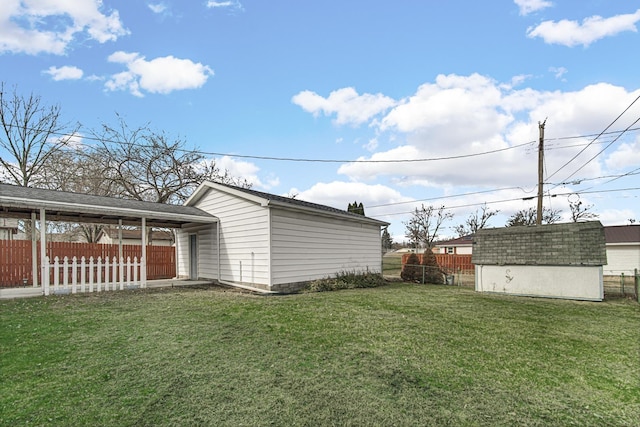 view of property exterior featuring a yard and a storage unit