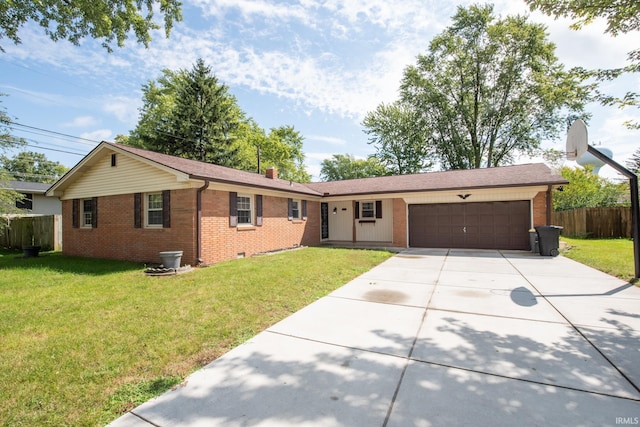 single story home with a garage and a front yard