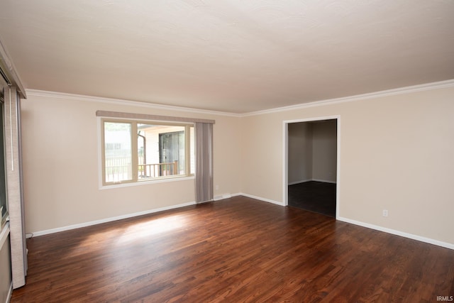 empty room with crown molding and dark wood-type flooring