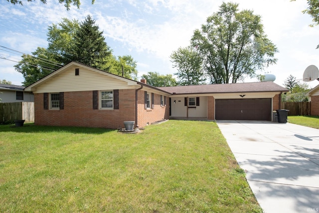 ranch-style home featuring a garage and a front lawn