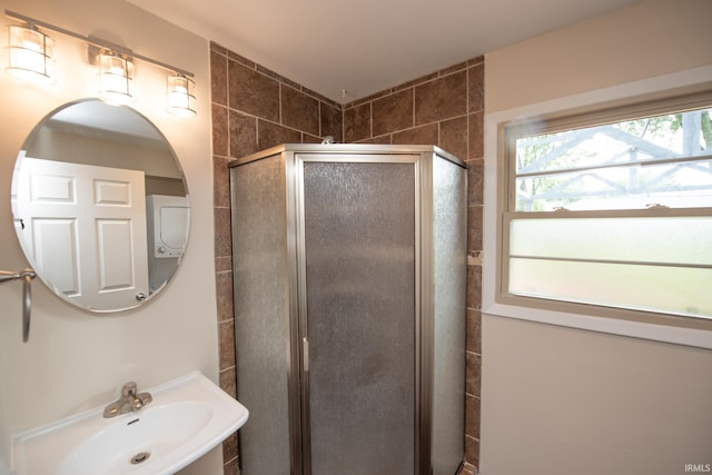 bathroom featuring sink and an enclosed shower