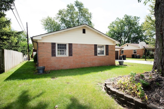 rear view of property with a yard