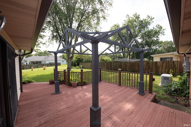 wooden terrace featuring a pergola, a lawn, and central air condition unit