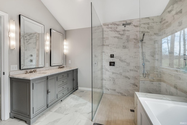 bathroom with lofted ceiling, vanity, and separate shower and tub