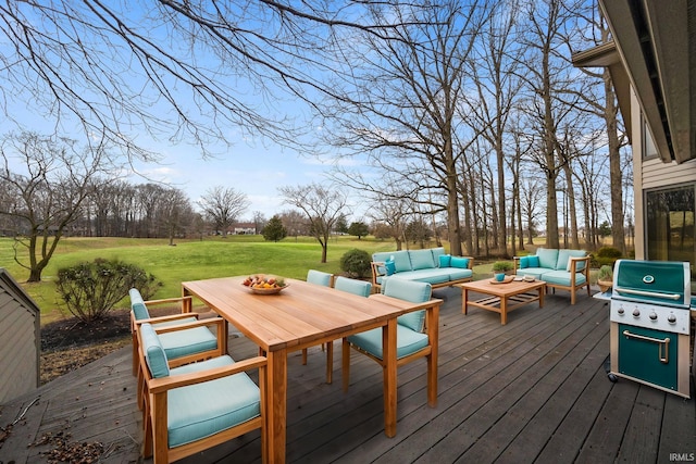 wooden terrace with outdoor lounge area, grilling area, and a lawn