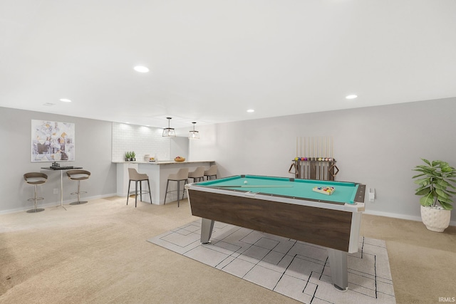 recreation room featuring billiards, light colored carpet, and bar area