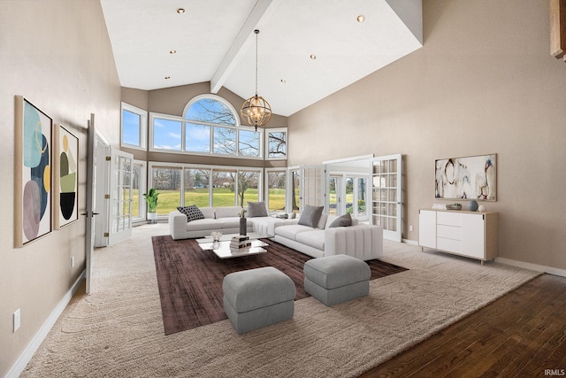 living room featuring french doors, an inviting chandelier, high vaulted ceiling, light wood-type flooring, and beamed ceiling