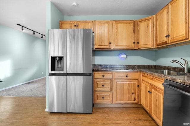 kitchen with sink, black dishwasher, stainless steel fridge with ice dispenser, and light wood-type flooring