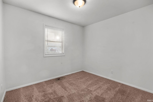 empty room featuring carpet flooring