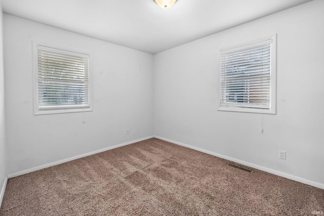 spare room featuring carpet floors