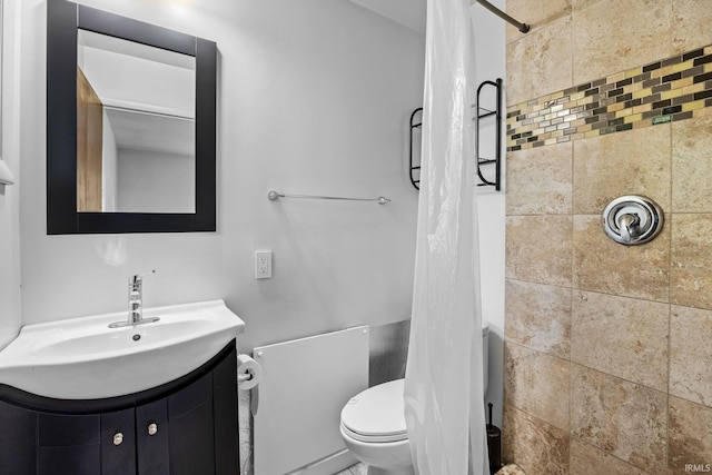 bathroom with walk in shower, vanity, and toilet