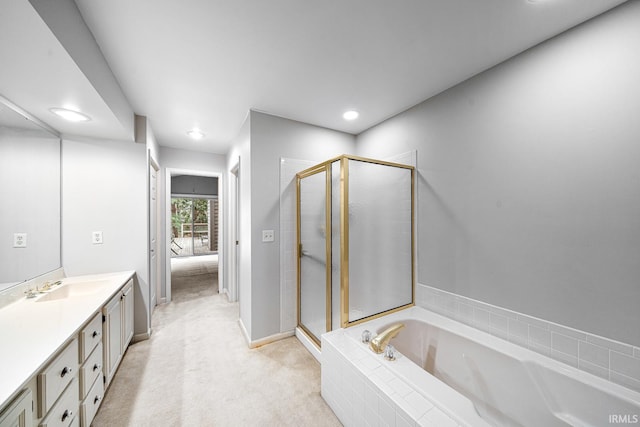 bathroom featuring vanity and separate shower and tub