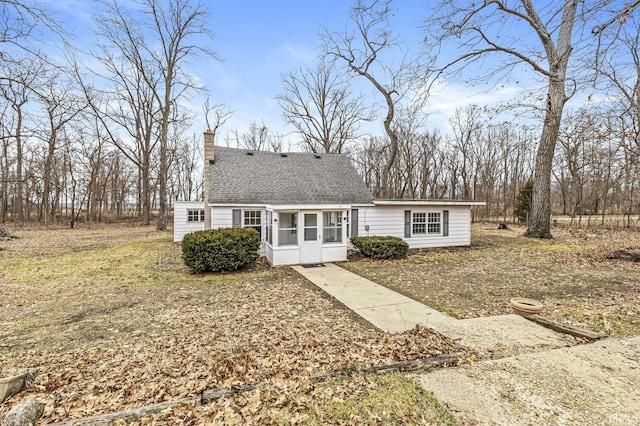 view of front of home featuring a sunroom