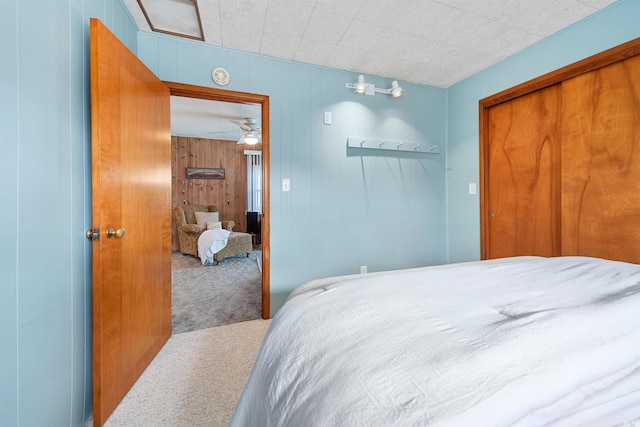 carpeted bedroom featuring a closet