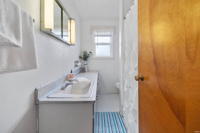 bathroom with vanity and toilet