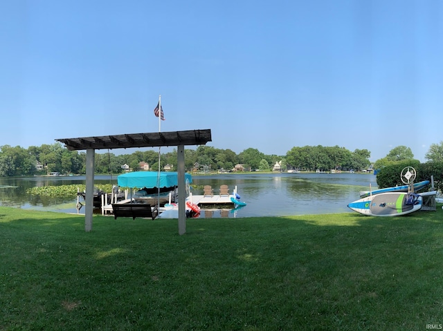 view of dock with a water view and a yard