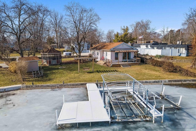 view of dock with a yard